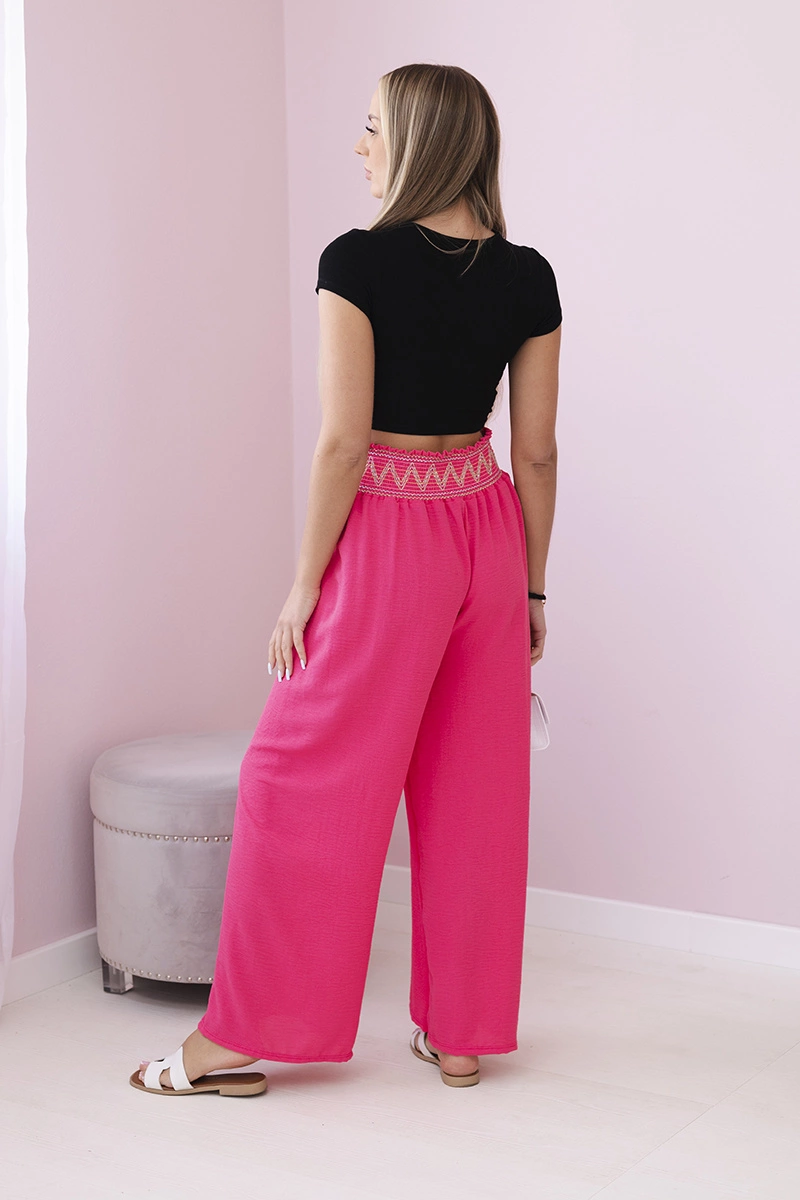 Trousers with a wide elastic waistband in pink color