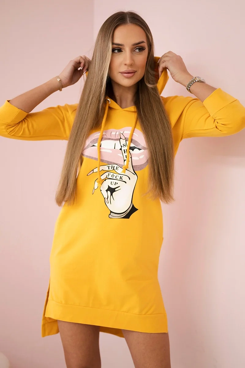 Dress with a longer back and a colorful mustard print