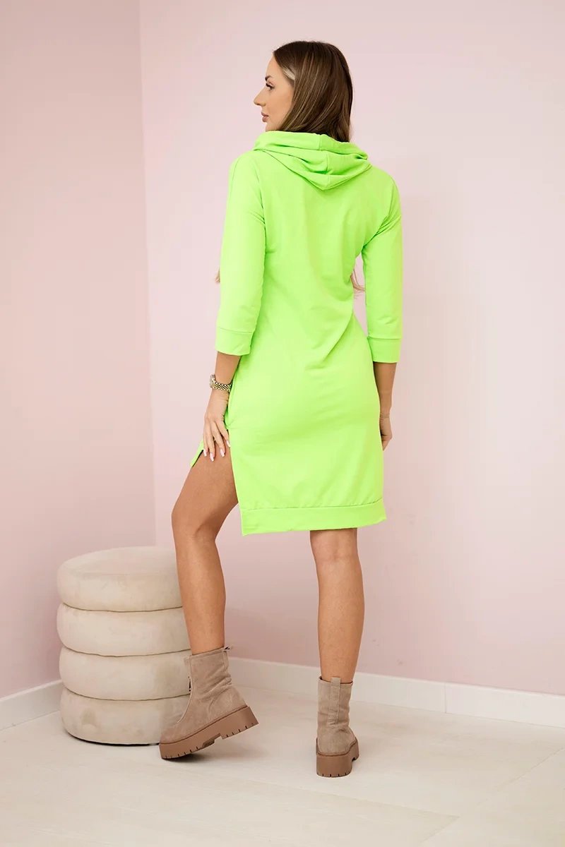 Dress with a longer back and a colorful green neon print