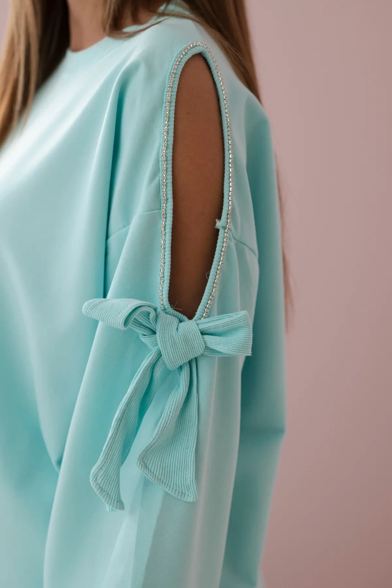 Set of sweatshirts with a bow on the sleeves and mint leggings