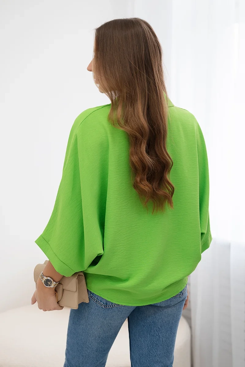 Oversized blouse with button fastenings in light green color