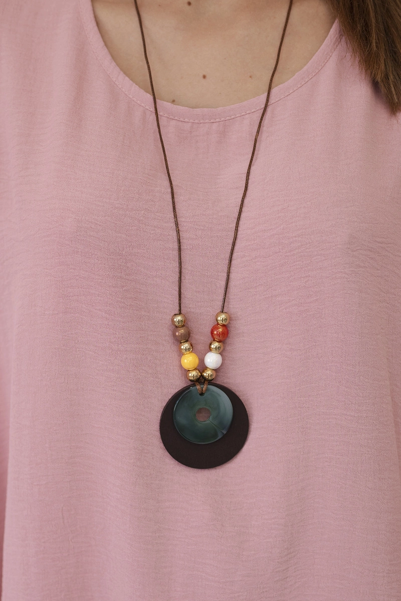 Oversized blouse with pendant in dark pink color