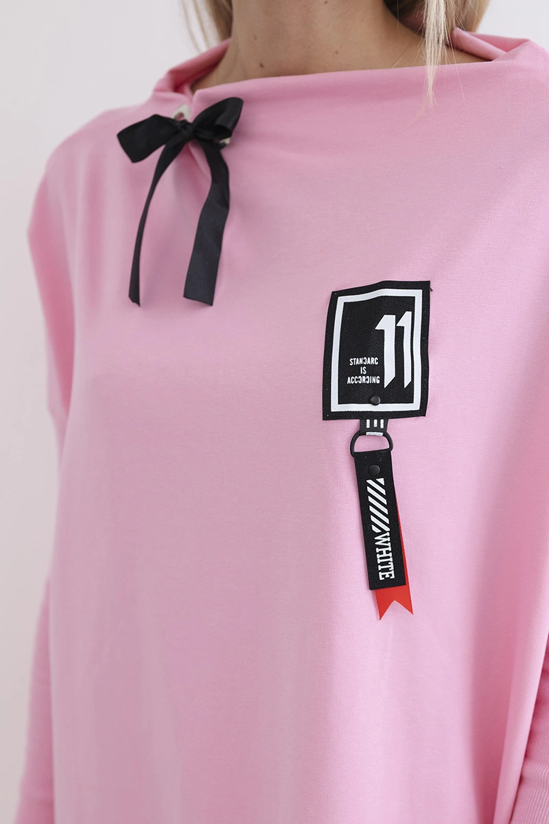 Oversized sweatshirt with asymmetrical sides in light pink color
