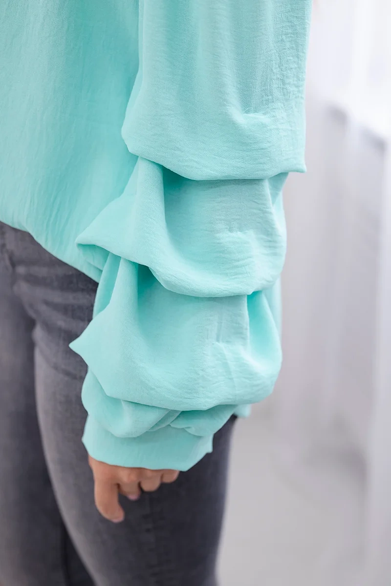 Spanish blouse with decorative mint sleeves