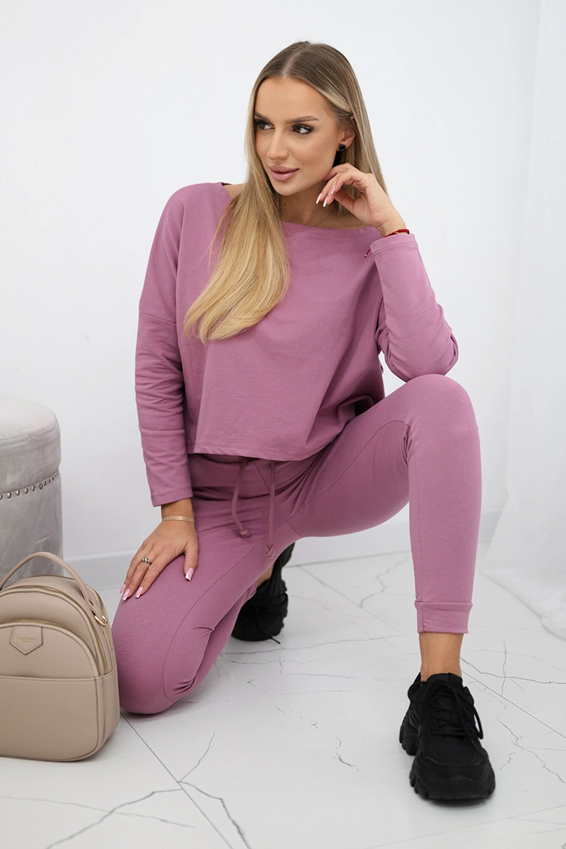Complete with an oversized blouse in dark pink