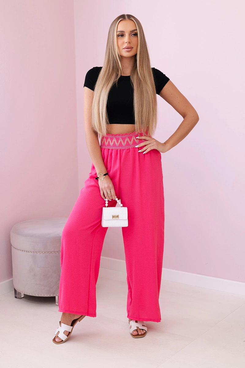 Trousers with a wide elastic waistband in pink color