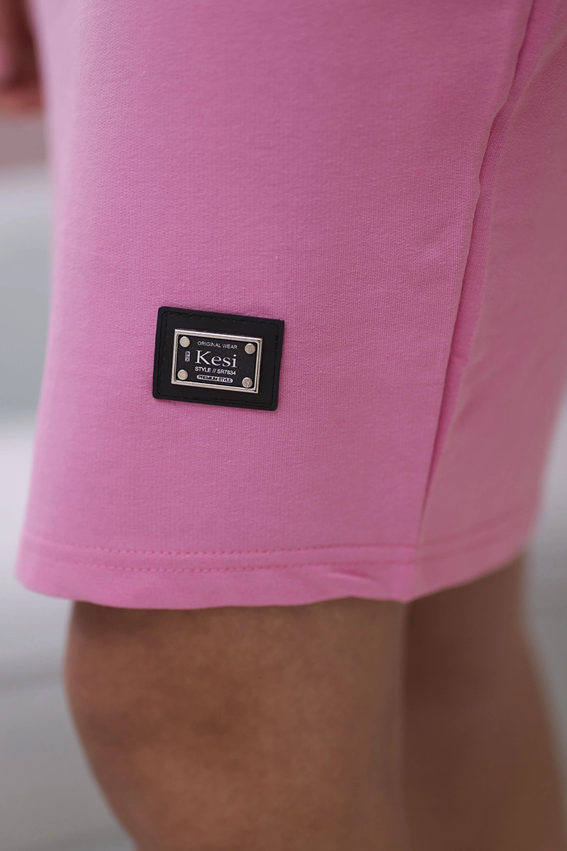 Pink dress with a tie at the neck
