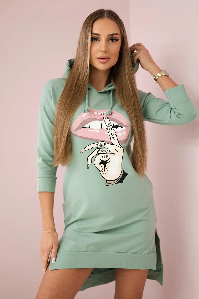 Dress with a longer back and a colorful dark mint print