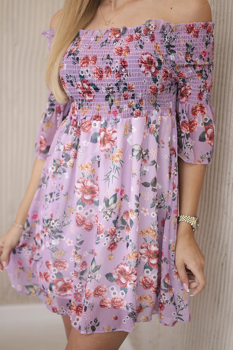 Shoulder dress with a floral pattern in purple color