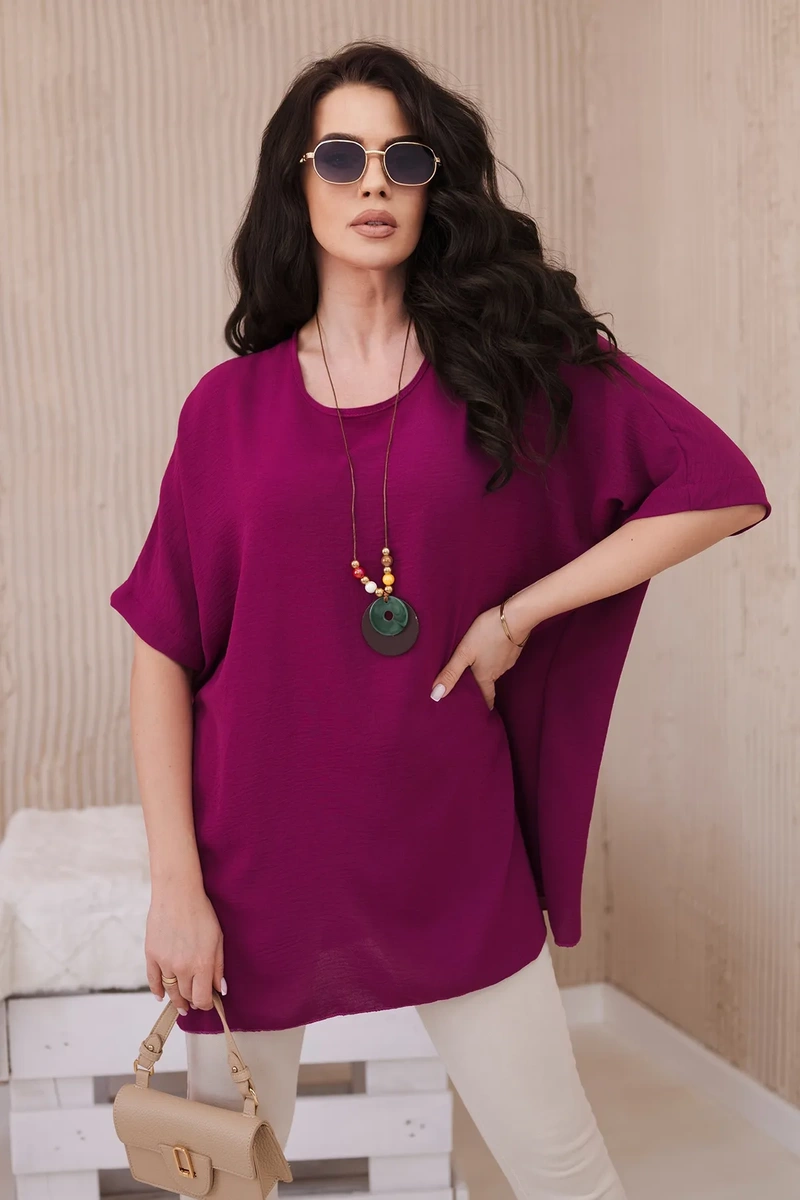 Oversized blouse with plum pendant