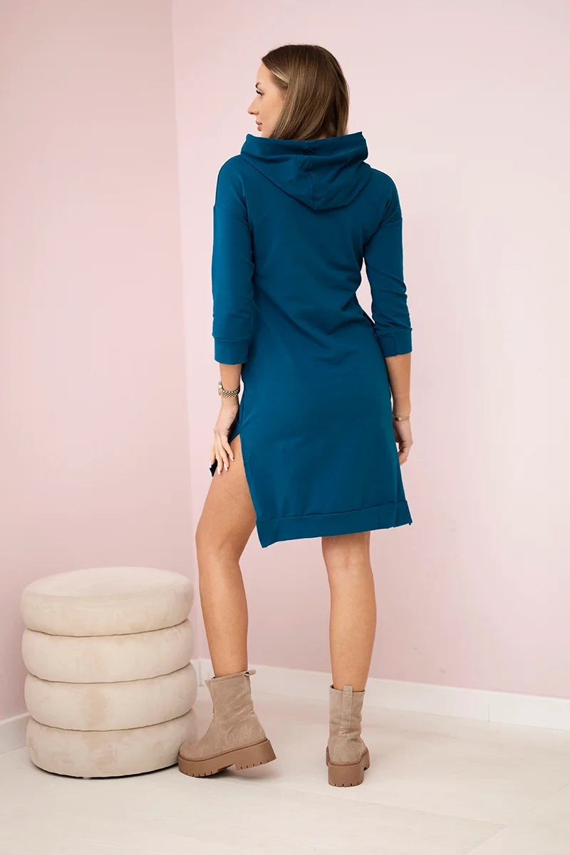Dress with a longer back and a colorful marine print