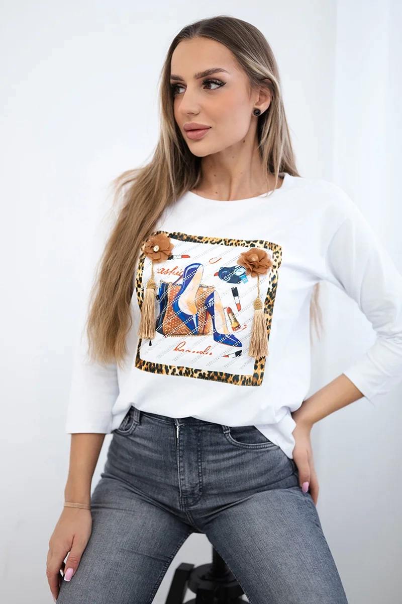 Blouse with 3D graphics and decorative pom pom white