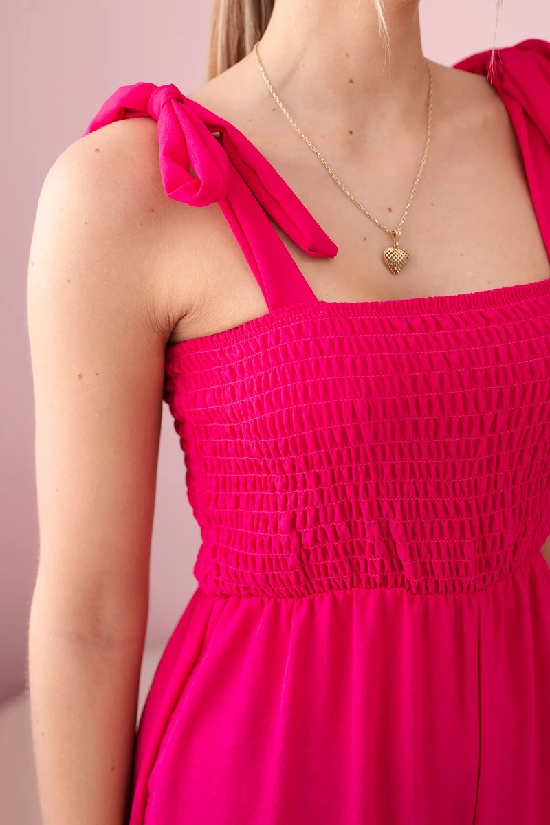 Waisted jumpsuit with a pleated fuchsia-coloured top