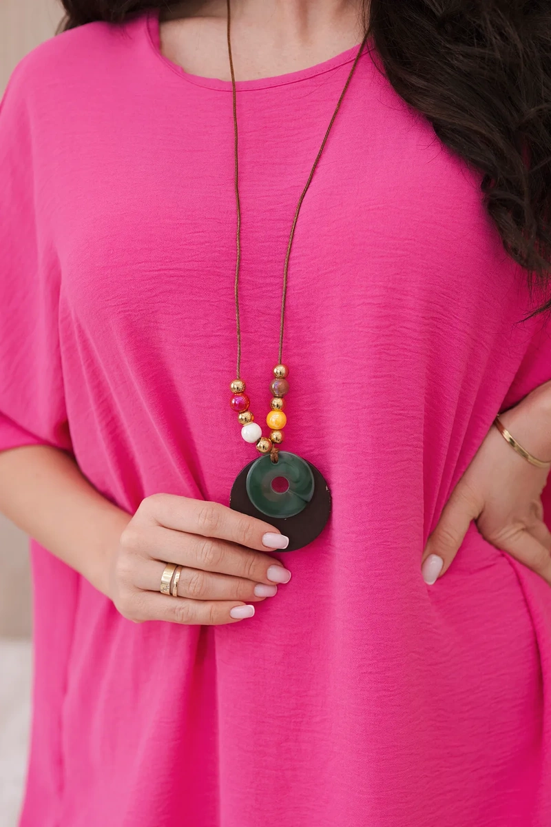 Oversized blouse with a pendant in pink color