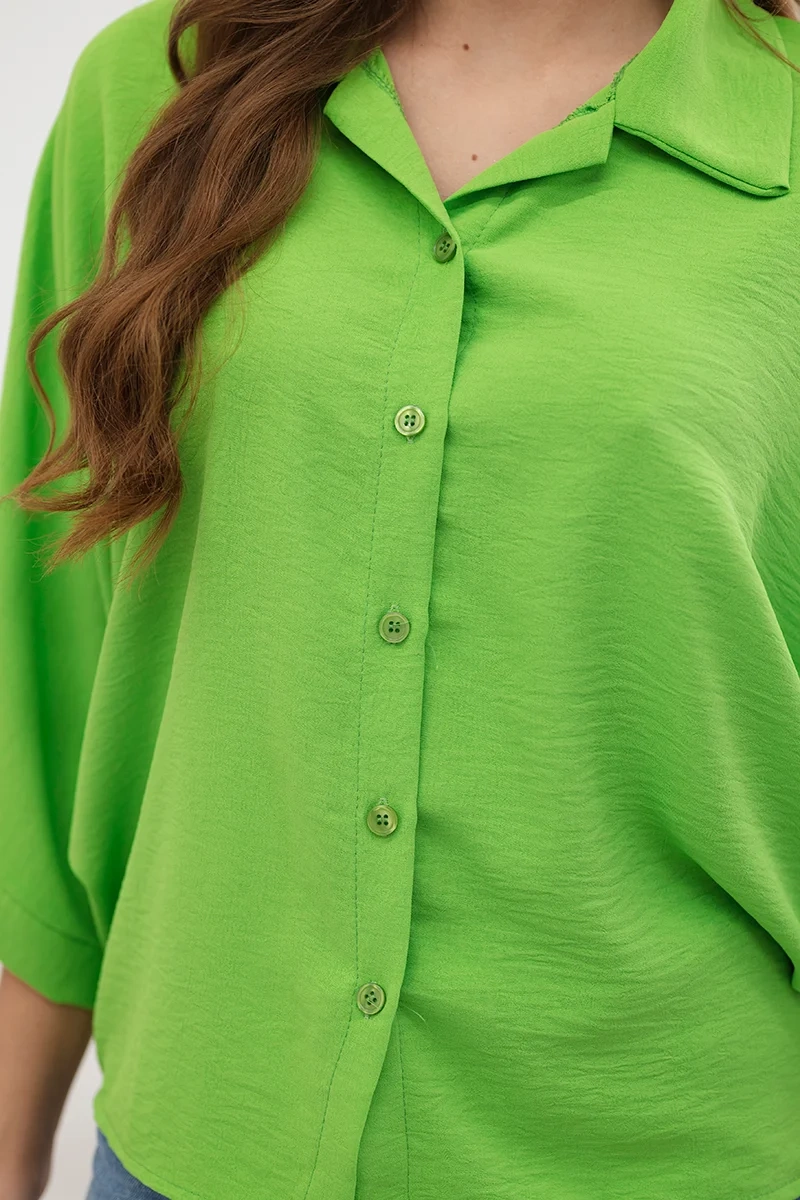 Oversized blouse with button fastenings in light green color