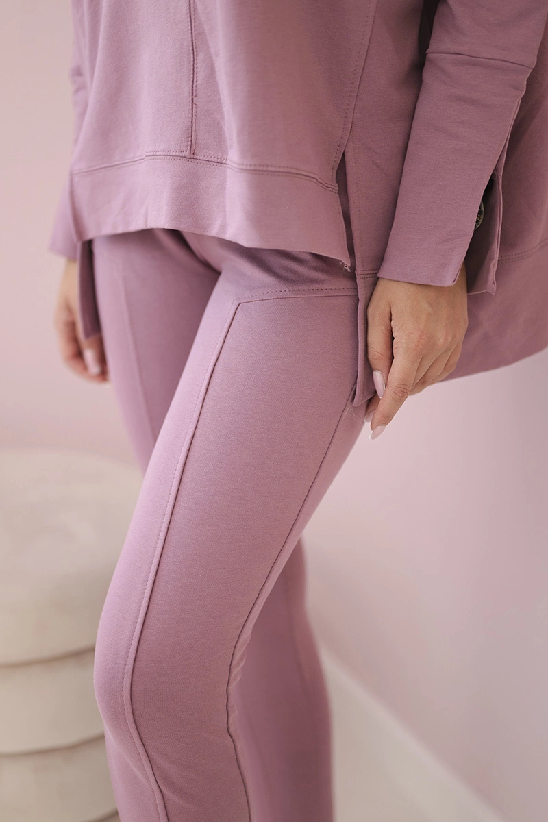 Complete with an oversized blouse in dark pink