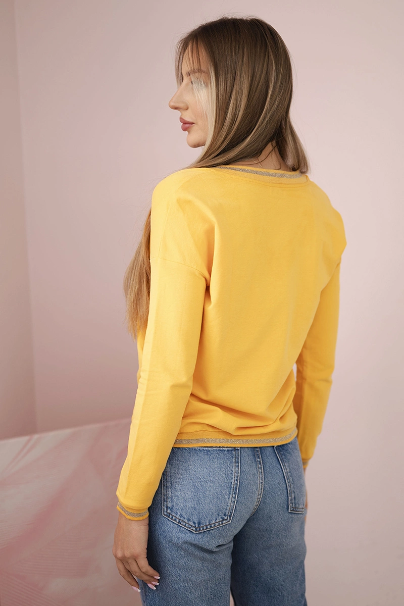 Kesi Women&#039;s sweatshirt with a sequin inscription mustard