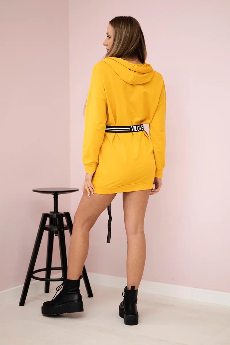 Dress decorated with a mustard inscription tape