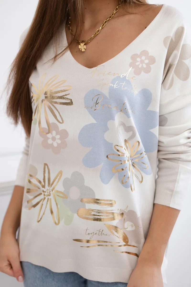 Blouse with a floral motif in beige color