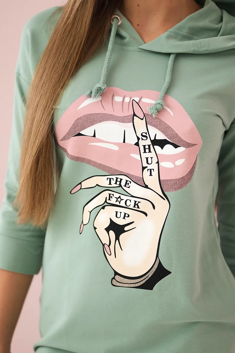 Dress with a longer back and a colorful dark mint print