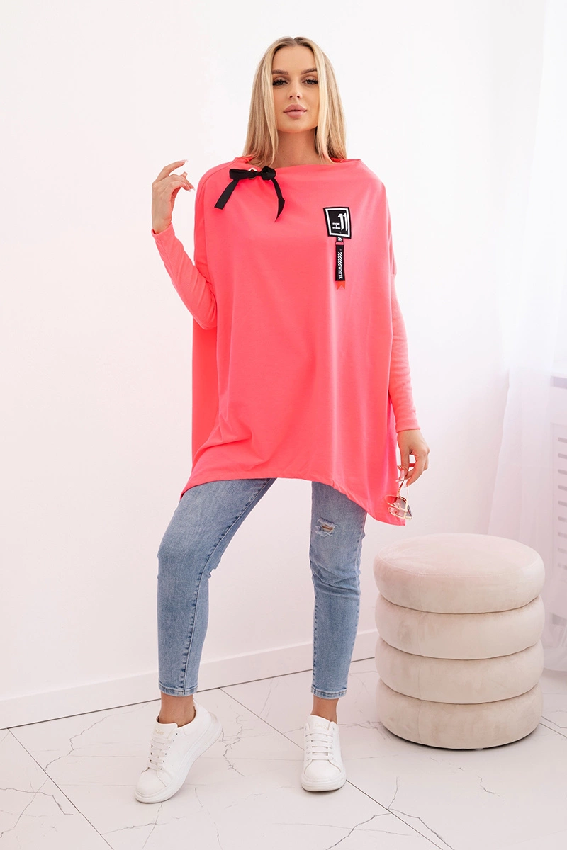 Oversized sweatshirt with asymmetrical sides in pink neon color