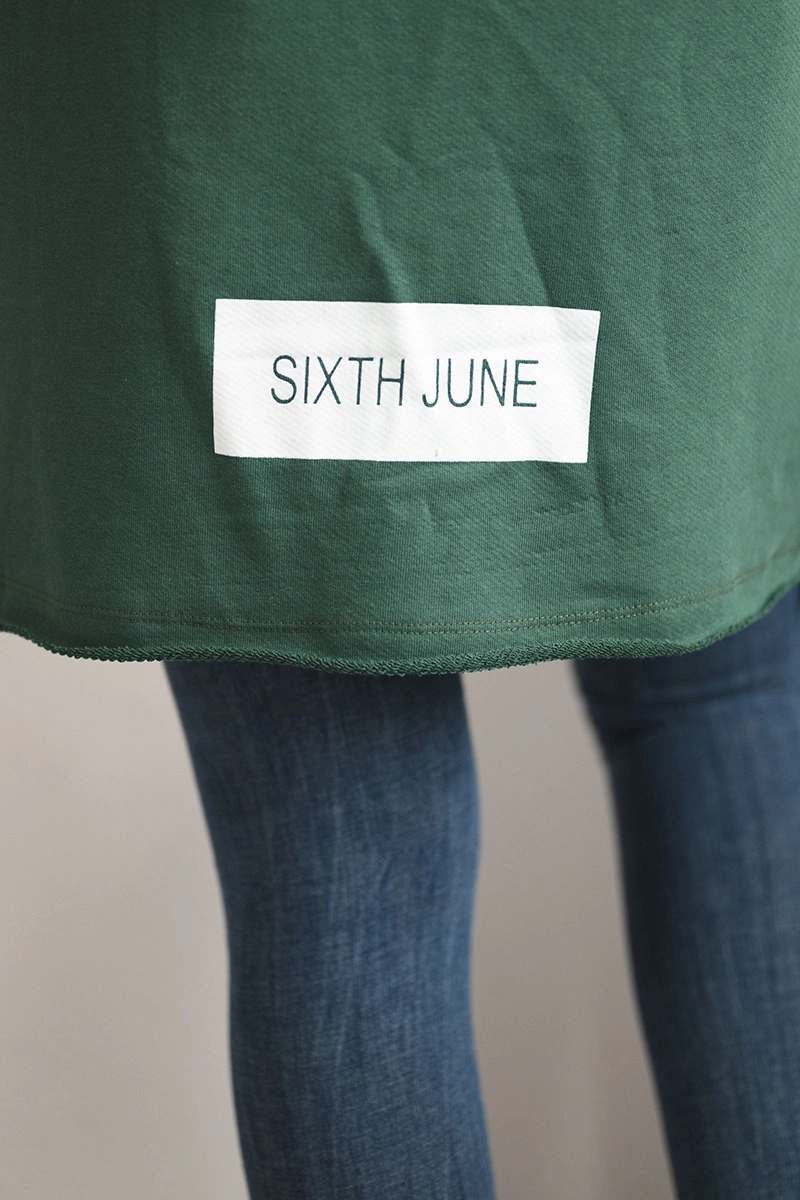 Coatee with green subtitles