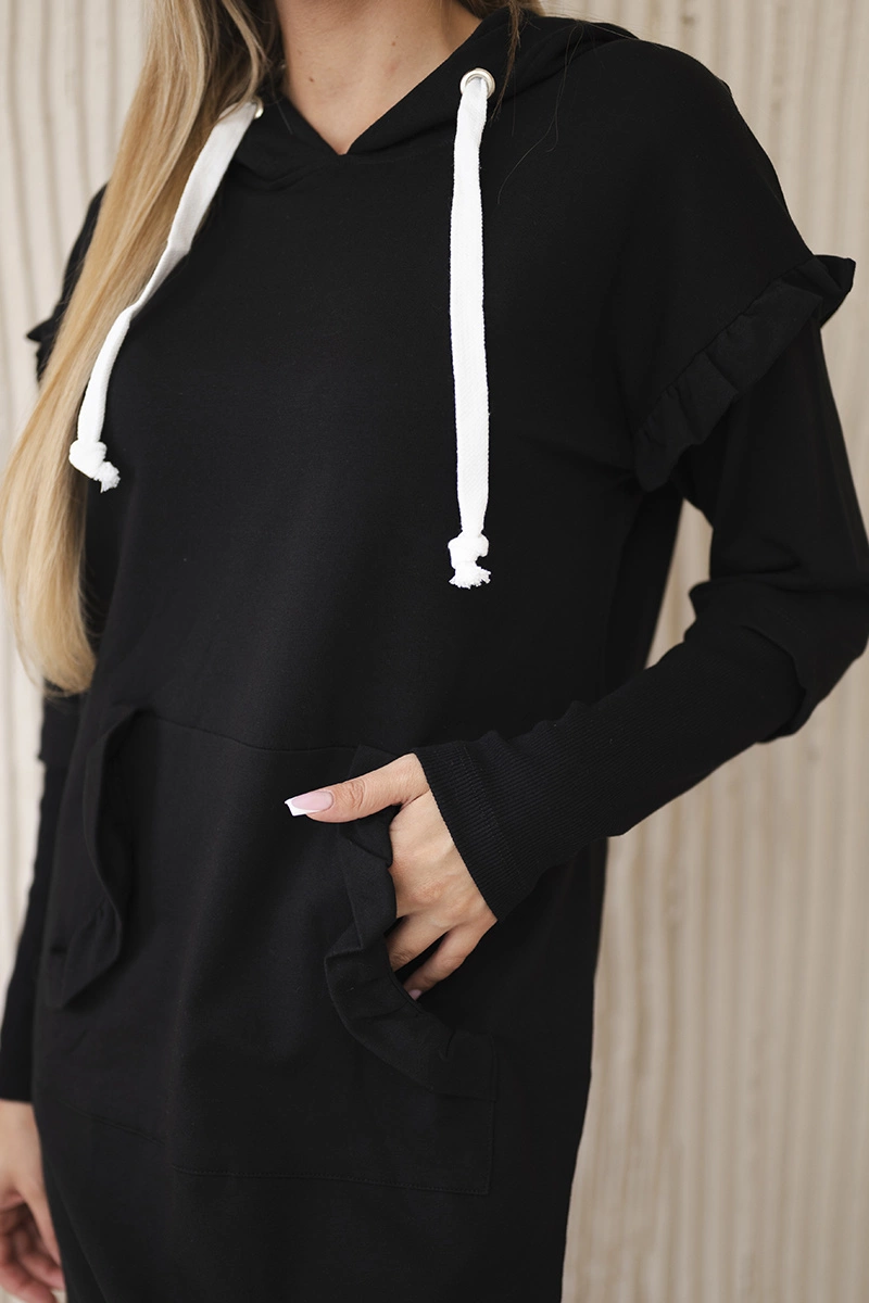 Black dress with decorative ruffles and hood