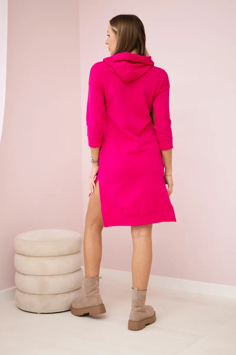 Dress with a longer back and a colorful fuchsia print