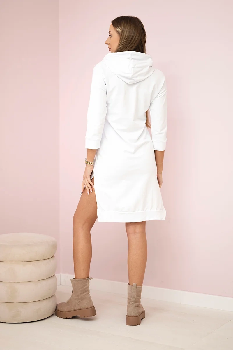 Dress with a longer back and a colorful print white