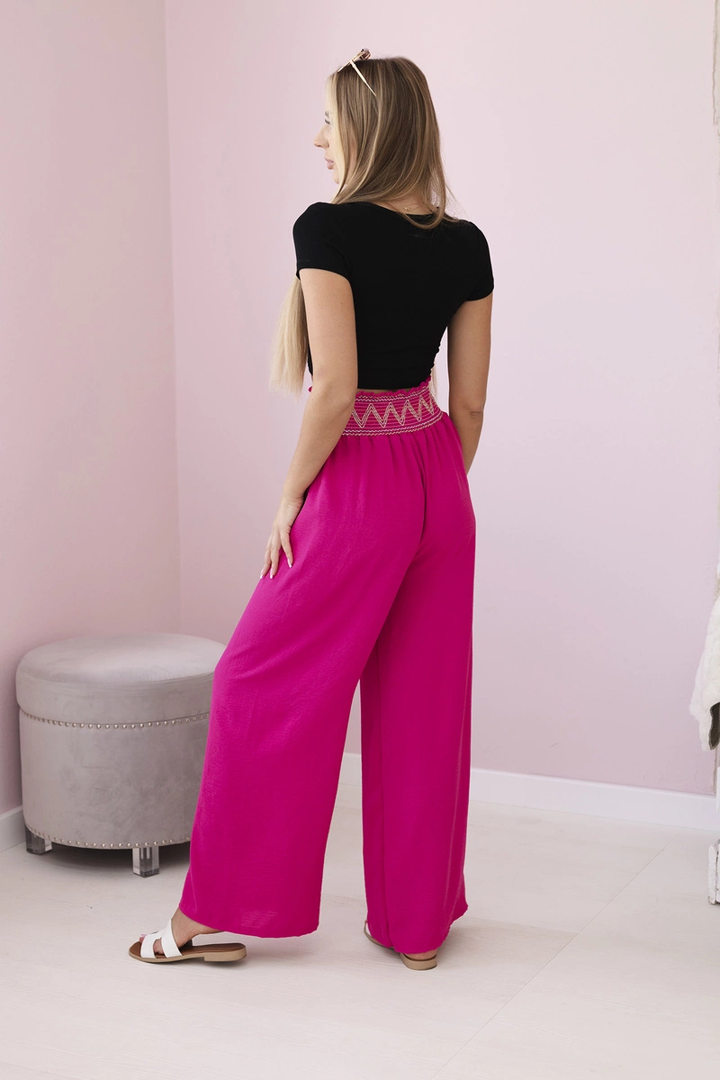 Trousers with a wide elastic waistband in fuchsia