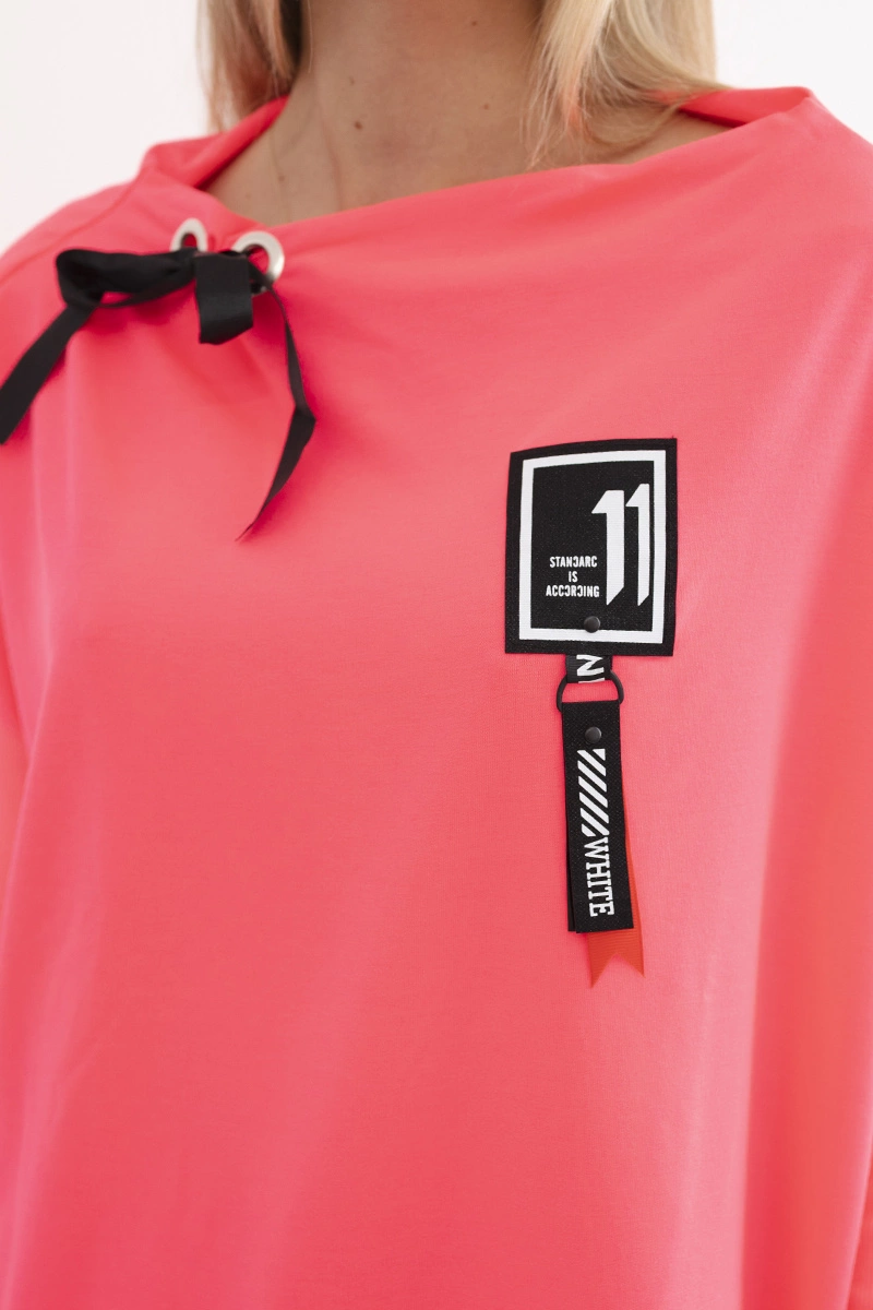 Oversized sweatshirt with asymmetrical sides in pink neon color