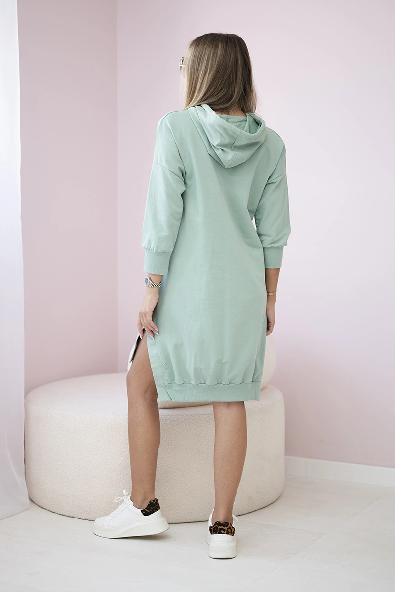Dress with a hood and a long back in dark mint