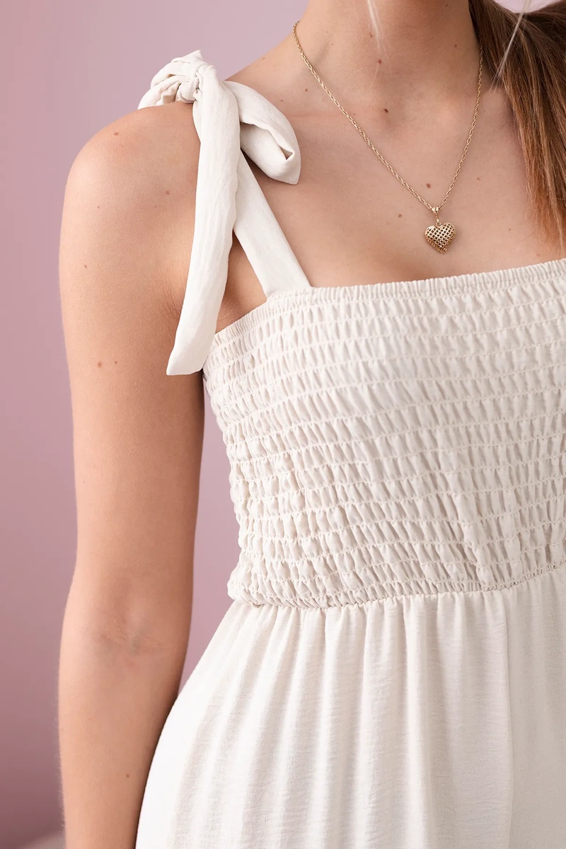 Strappy jumpsuit with frilly top in beige